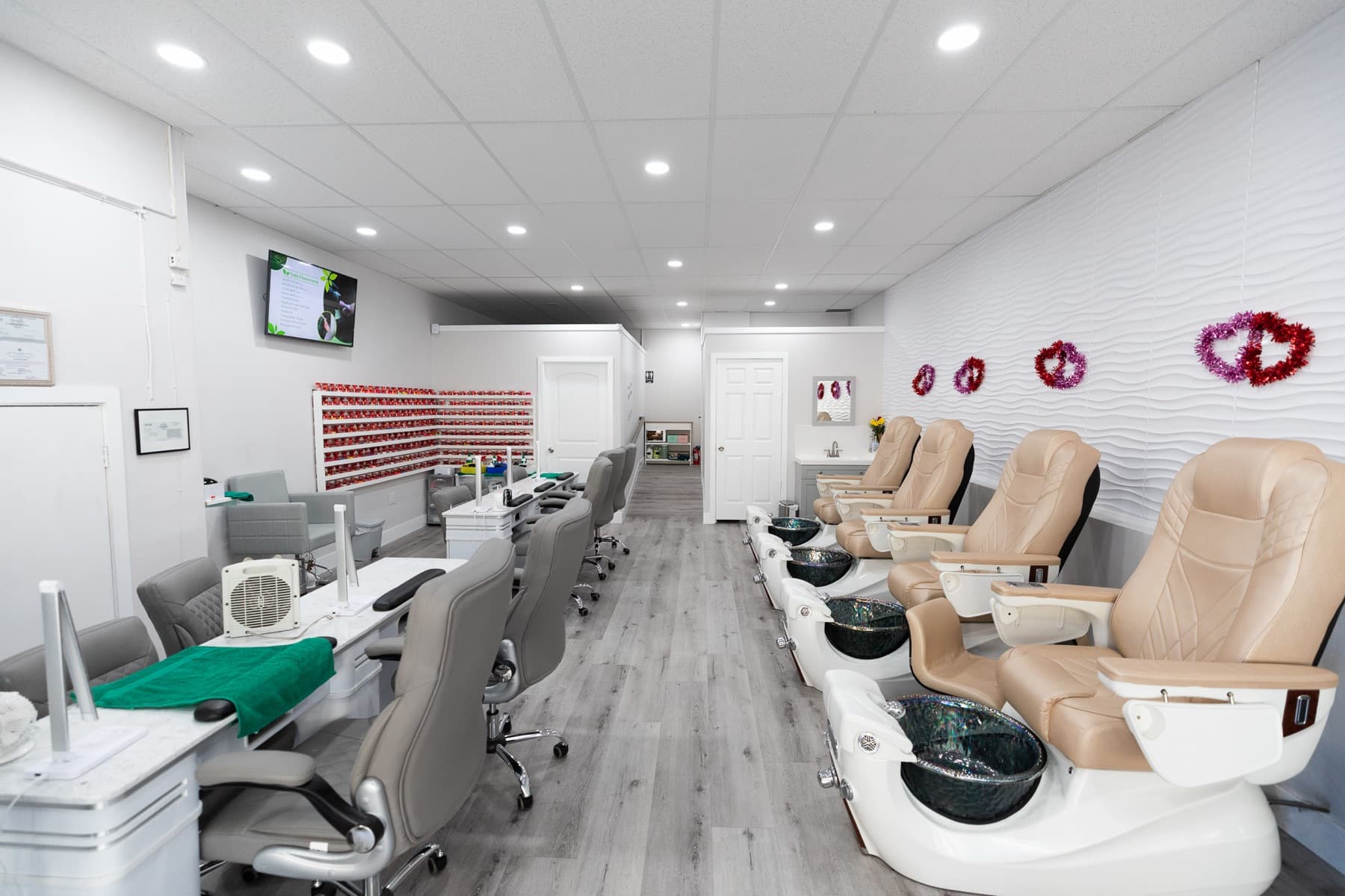 Inside Kim Nails and Beauty Lounge: manicure tables and pedicure chairs